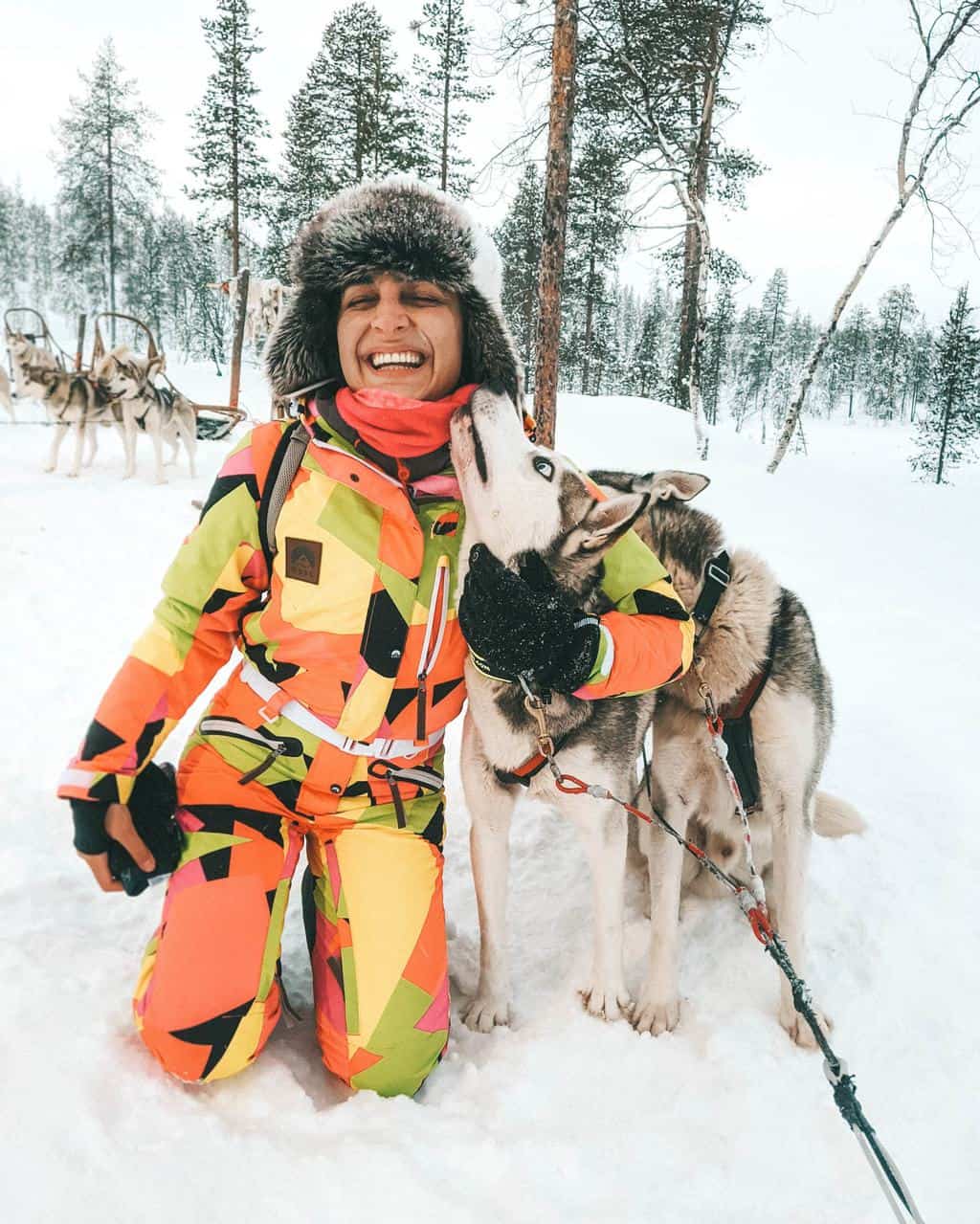 a girl hugging a Siberian husky Finnish Lapland, Lapland destinations, Lapland Finland, Inghams