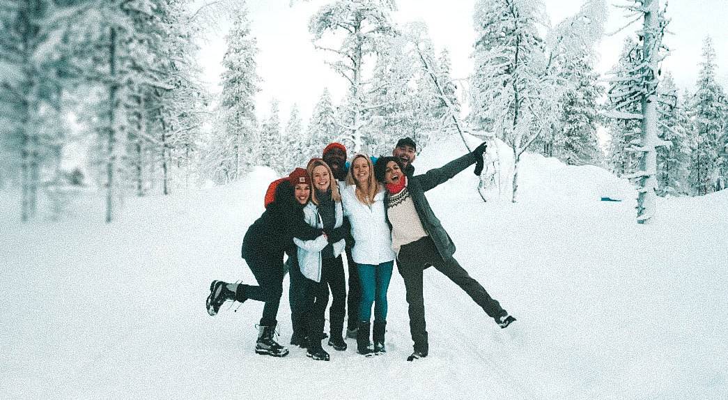 a happy group surrounded by snow Finnish Lapland, Lapland destinations, Lapland Finland, Inghams