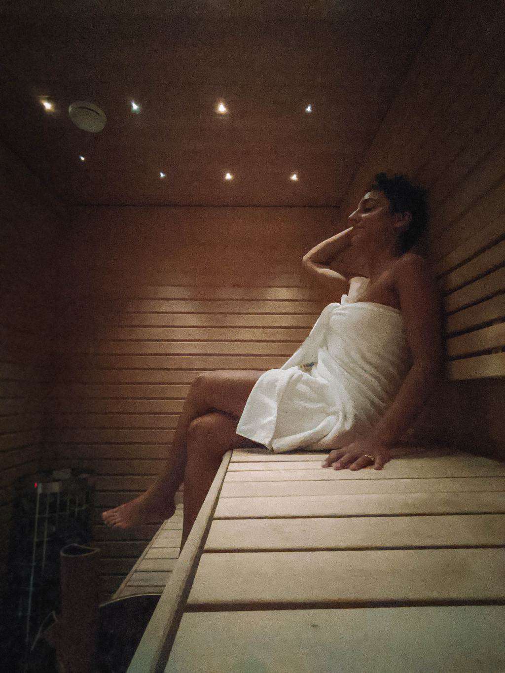 a woman enjoying a sauna Finnish Lapland, Lapland destinations, Lapland Finland, Inghams