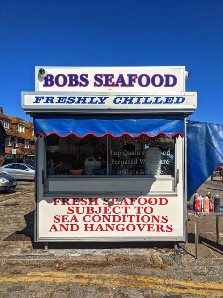 A seafood hut with 'Bobs Seafood' written at the top, setlling freshly chilled seafood 'subject to sea conditions and hangovers'